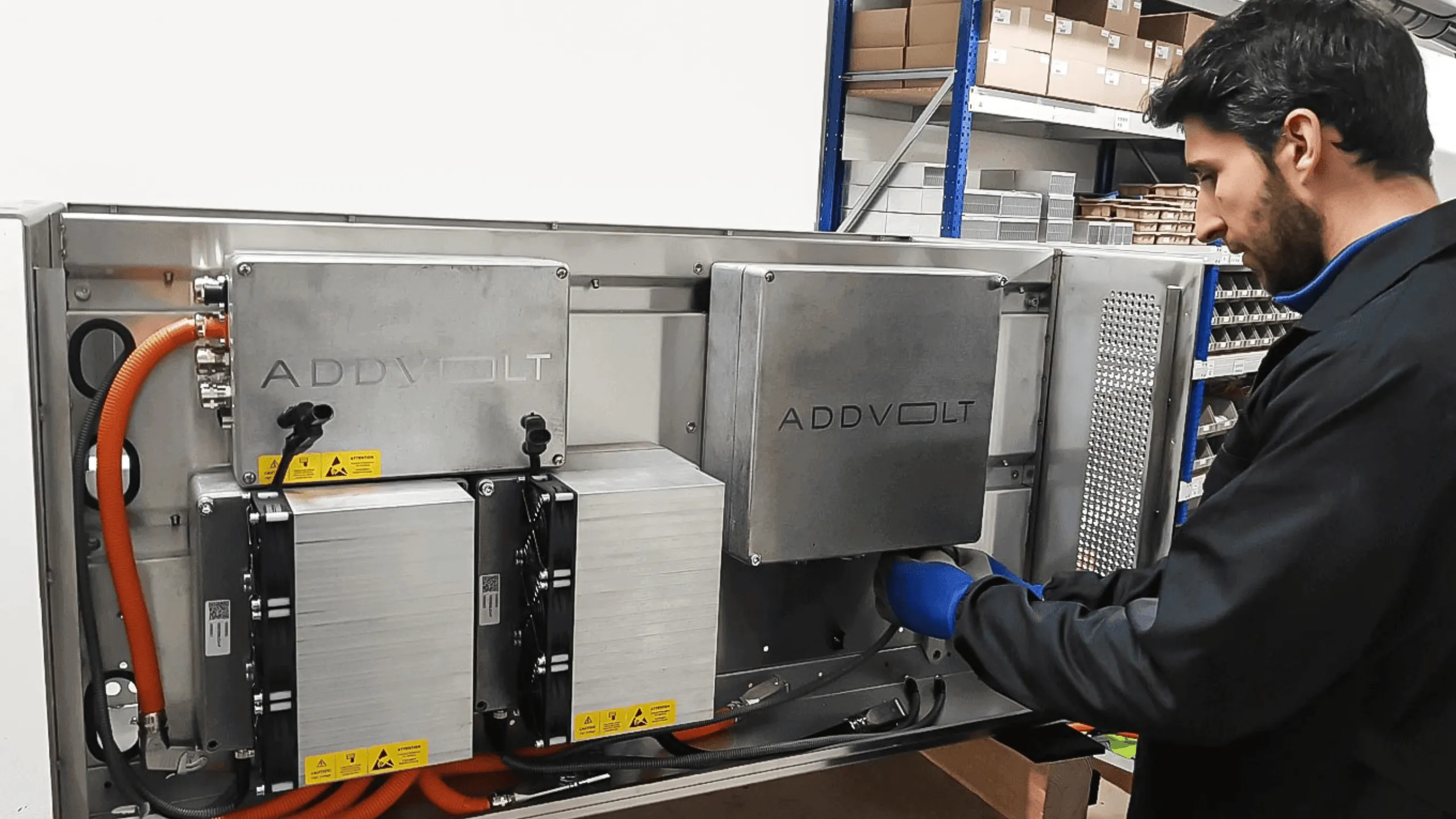 Symbolic image of AddVolt SA at abacus alpha: Technician installing an ADDVOLT electrical system in an industrial environment.