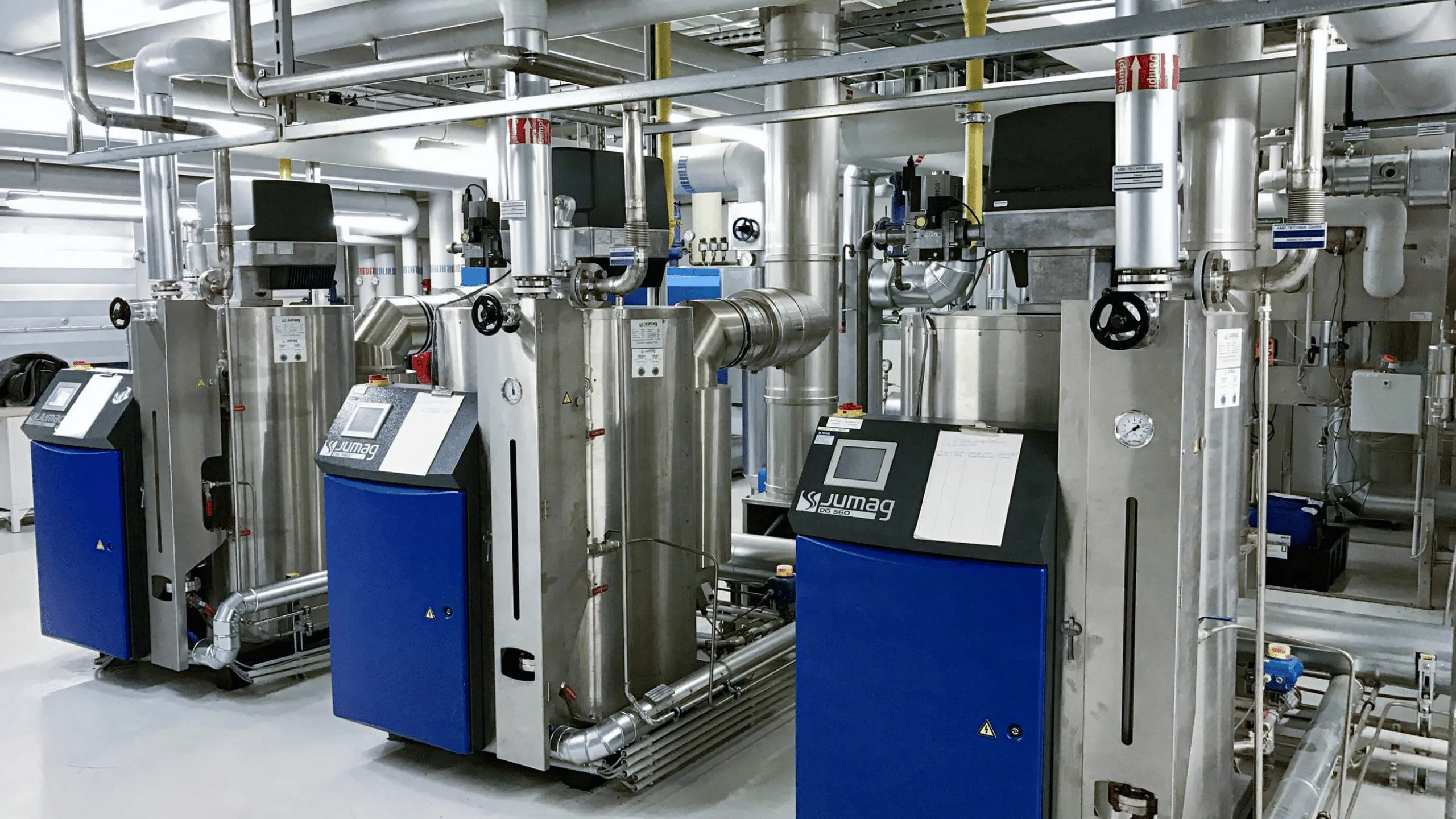 Symbolic image of Jumag Dampferzeuger GmbH at Abacus alpha: Industrial steam boiler system from Jumag with modern piping infrastructure.