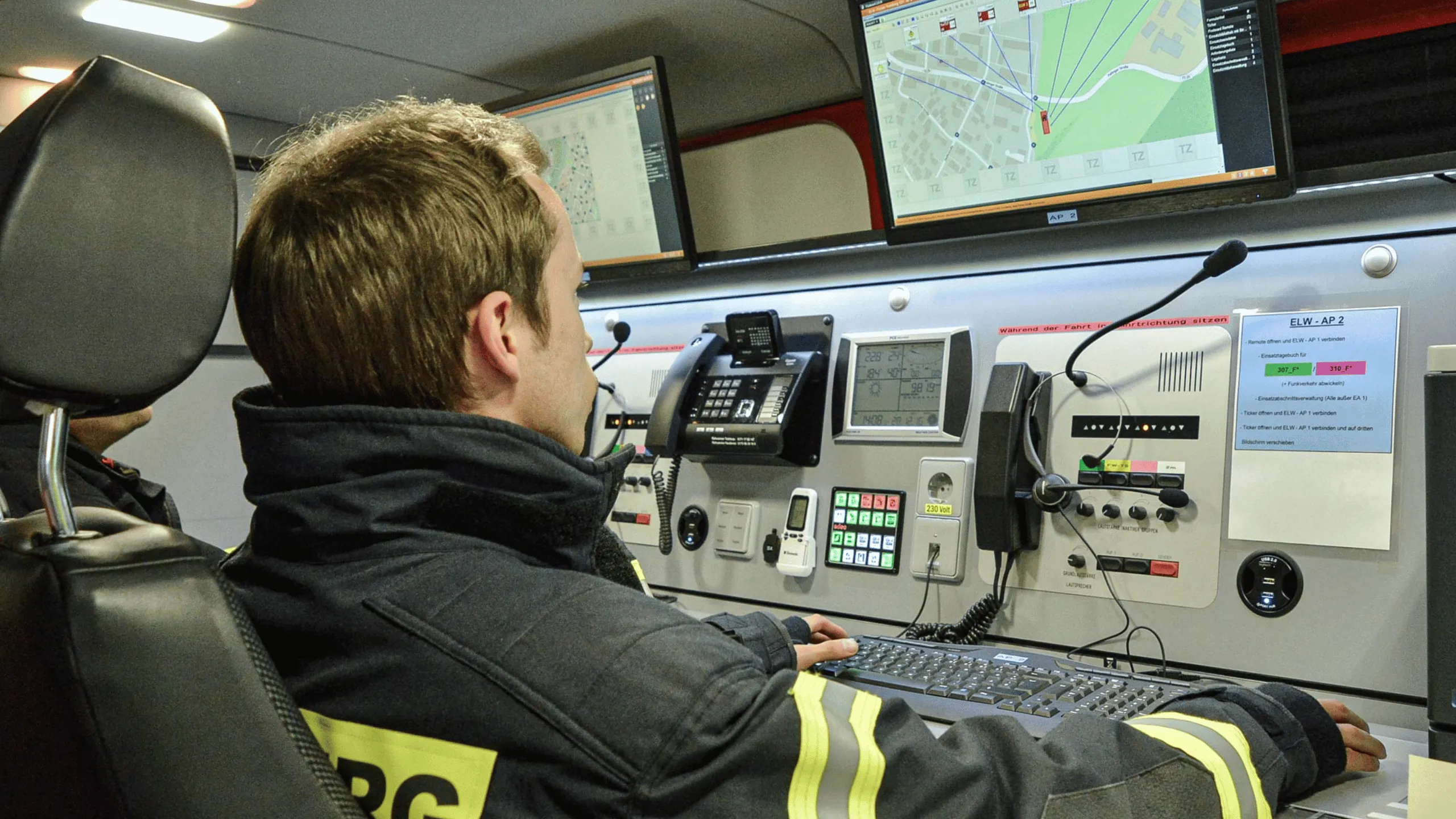 Symbolic image Fireboard GmbH at Abacus alpha: Firefighter monitors operational coordination and communication in a mobile control center.