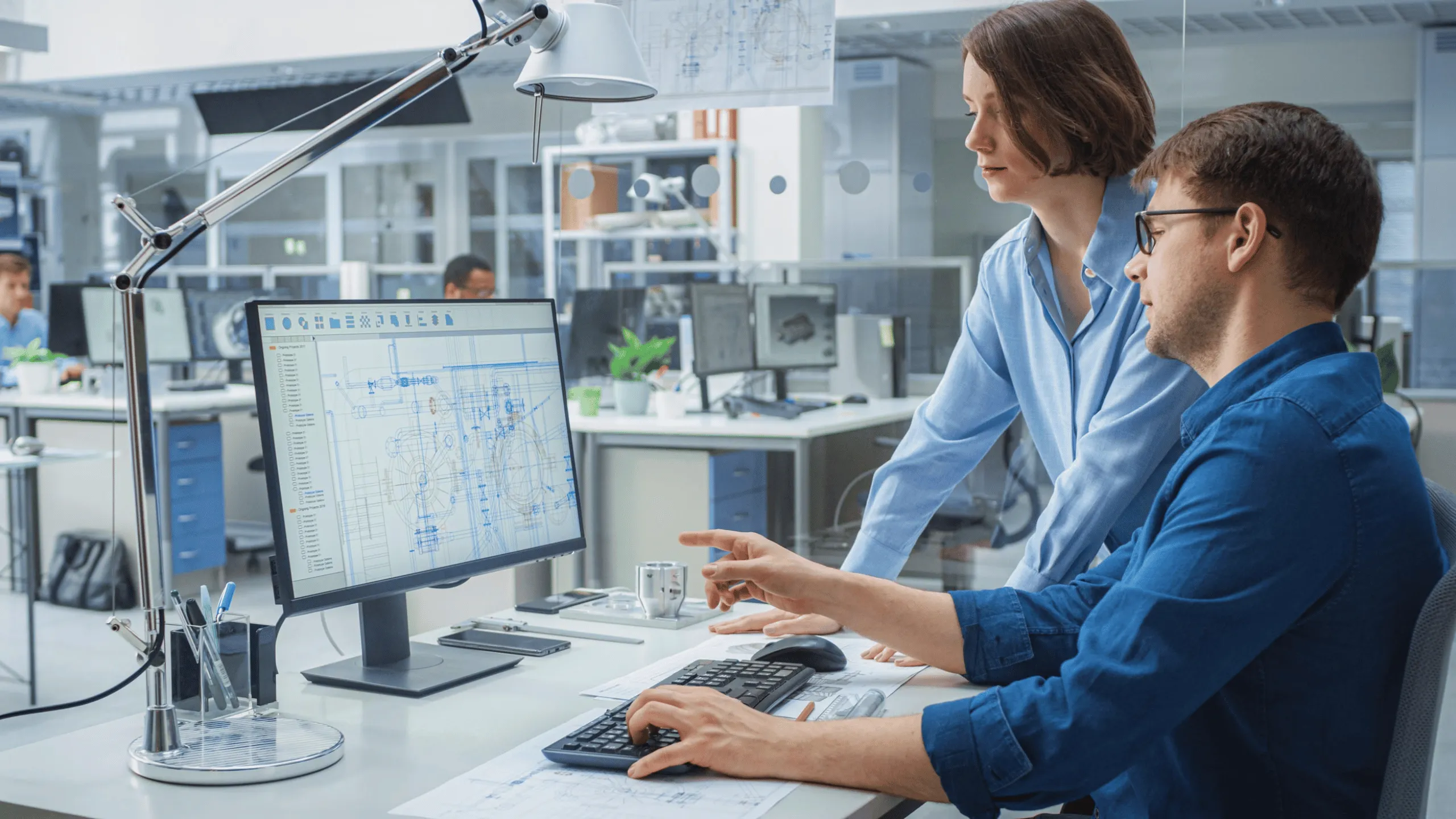 Symbolic image of VSR Elektrotechnik GmbH at Abacus alpha: Two engineers working together on a CAD design on a computer in a modern office.